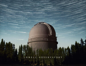 Lowell Observatory: Welcome to Arizona—observatory dome amid pines with sweeping night sky star trails.