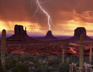 Welcome to Arizona: lightning strikes over Monument Valley buttes at sunset, with desert cacti in the foreground.